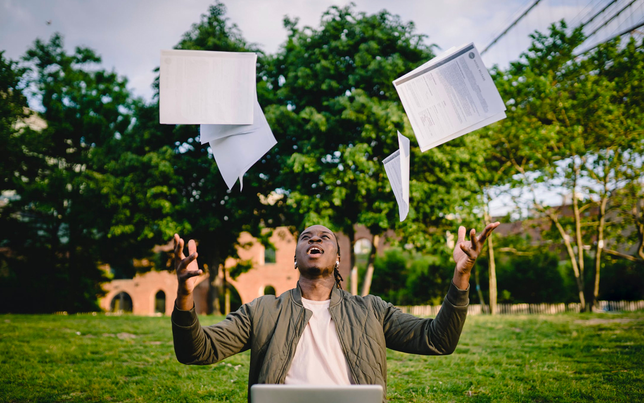 reader tossing book in the air